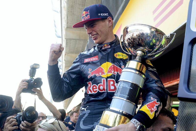 Infiniti Red Bull's Belgian-Dutch driver Max Verstappen  celebrates winning with his team at the Circuit de Catalunya on May 15, 2016 in Montmelo on the outskirts of Barcelona after the Spanish Formula One Grand Prix. (Photo by JOSEP LAGO / AFP)