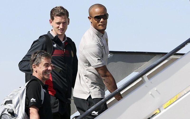 Jan Vertonghen, left, and Vincent Kompany board Belgium's team plane bound for Brazil on Tuesday. Francois Lenoir / Reuters / June 10, 2014