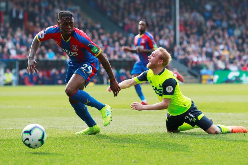 Crystal Palace's Aaron Wan-Bissaka in action with Huddersfield Town's Alex Pritchard. Action Images via Reuters