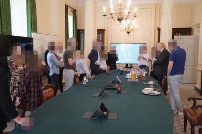 An image published by the Privileges Committee showing a June 19, 2020, gathering attended by Boris Johnson. Photo: UK Parliament