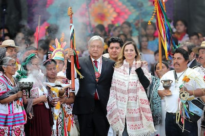 President of Mexico AndrÃ©s Manuel Lopez Obrador announced that he tested positive for COVID-19. Has developed mild symptoms and is under medical treatment. MEXICO CITY, MEXICO - DECEMBER 01: Andres Manuel Lopez Obrador (L), President of Mexico poses with the baton alongside his wife Beatriz Gutierrez during the events of the Presidential Investiture as part of the 65th Mexico Presidential Inauguration at Zocalo on December 01, 2018 in Mexico City, Mexico. (Photo by Manuel Velasquez/Getty Images)