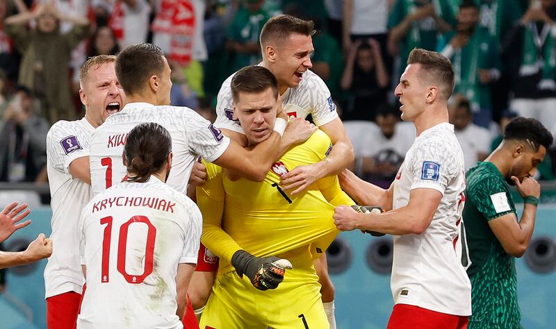 Poland's Wojciech Szczesny celebrates with teammates. Reuters