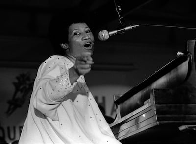 Singer Aretha Franklin points to the audience while singing and playing the piano during a concert at Chicago's Cook County Jail, ca.1970s. (Photo by Robert Abbott Sengstacke/Getty Images)