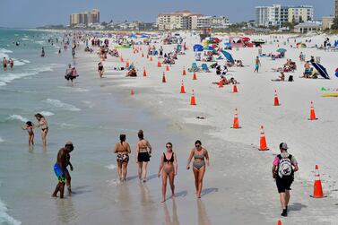 People take advantage of the weather as they spend time on Clearwater Beach, a popular spring break destination, west of Tampa, Florida. AP