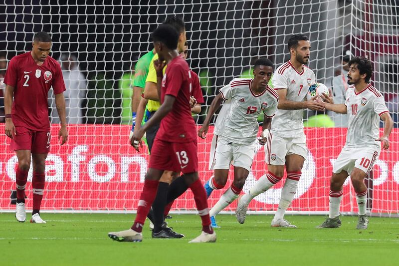 UAE's forward Ali Mabkhout (2nd-R) celebrates his goal during the 24th Arabian Gulf Cup Group A football match between Qatar and the United Arab Emirates at the Khalifa International Stadium in the Qatari capital Doha on December 2, 2019. / AFP / KARIM JAAFAR
