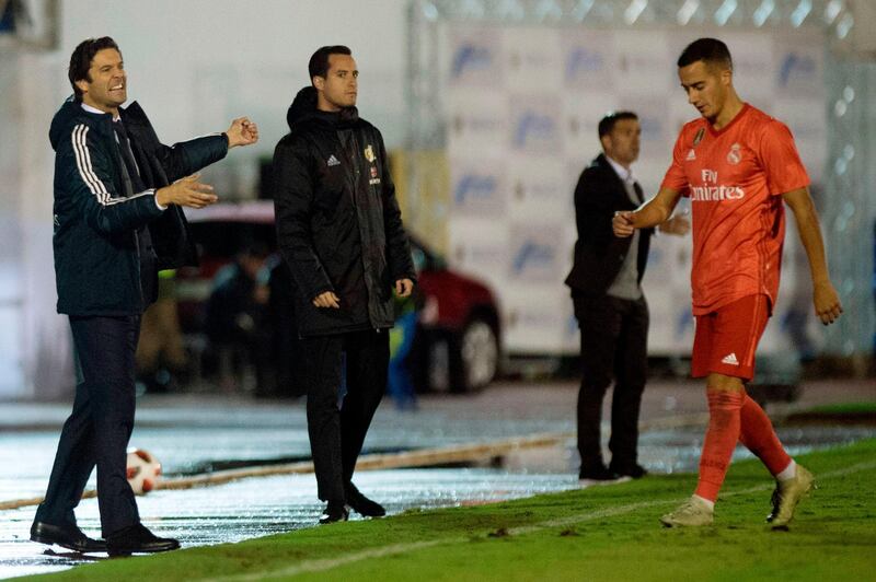 Real Madrid's Argentinian coach Santiago Solari gestures as Spanish midfielder Lucas Vazquez walks past during the Spanish King's Cup football match against UD Melilla. AFP