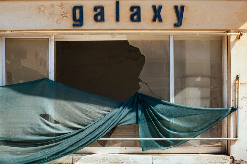 A ruined shop lies vacant