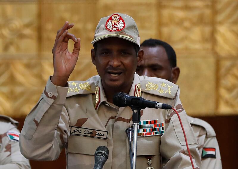 Sudanese Gen. Mohammed Hamdan Dagalo, the deputy head of the military council, addresses a speech to his supporters, during a rally to support the new military council that assumed power in Sudan after the overthrow of President Omar al-Bashir, and o protect the people's revolution, in Khartoum, Sudan, Sunday, June 16, 2019. Sudanese officials say al-Bashir is being taken to the prosecutor's office for corruption probe. (AP Photo/Hussein Malla)