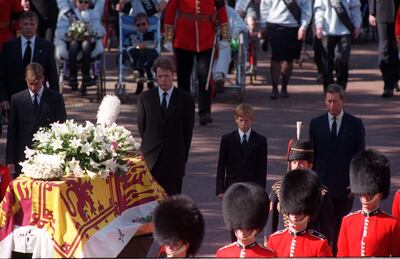 Princes William and Harry, Earl Spencer and Prince Charles walking behind the coffin of Princess Diana in 1997. PA