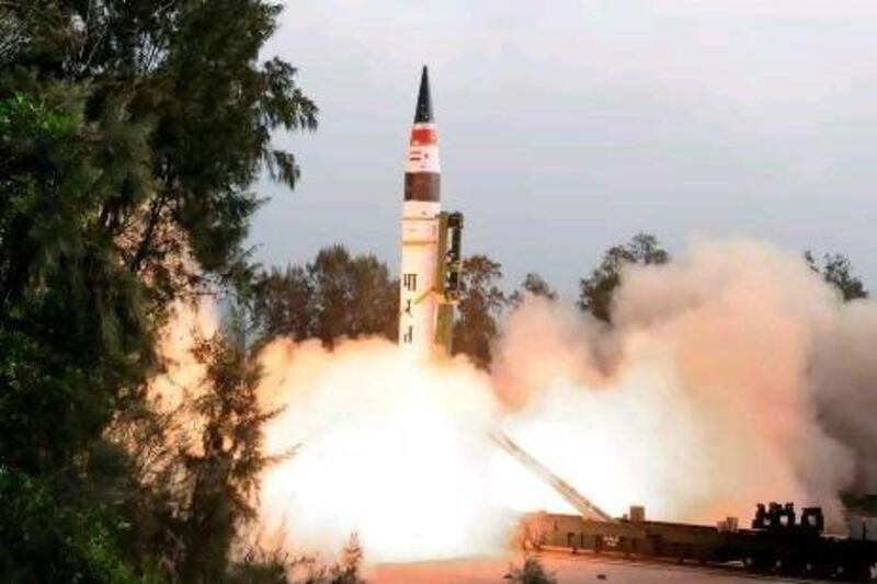 The Agni V missile launches from a site on Wheeler Island.  Defence Ministry of India / AFP