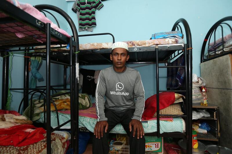 Abdul Kalam, from Bangladesh, survived last Saturday’s bus crash in which 13 of his colleagues died. He is pictured at his labour camp in Umm Al Quwain. Pawan Singh / The National 