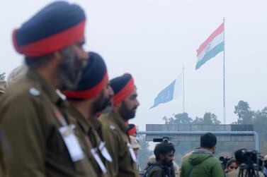 Indian policemen await for the return of Indian pilot Wing Commander Abhinandan Varthaman at the India-Pakistan Wagah border on March 1, 2019. AFP