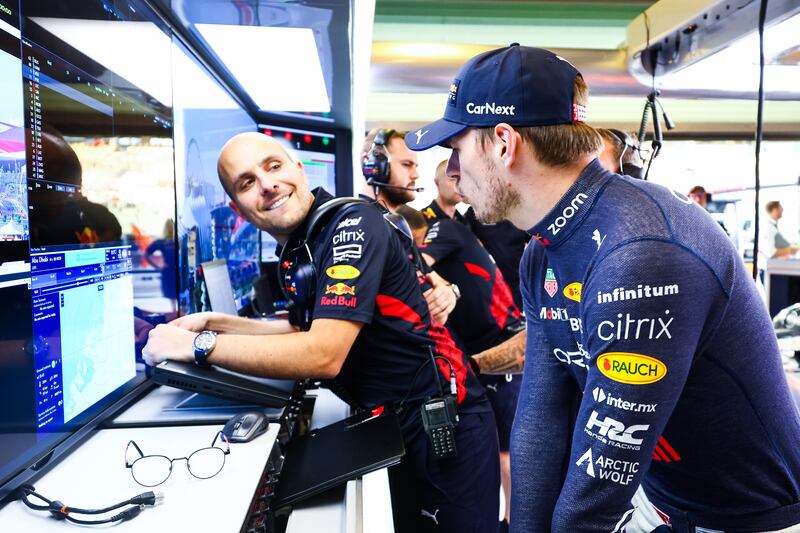 Max Verstappen of the Netherlands and Oracle Red Bull Racing talks with race engineer Gianpiero Lambiase in the garage during practice ahead of the F1 Grand Prix of Abu Dhabi at Yas Marina Circuit. Getty Images