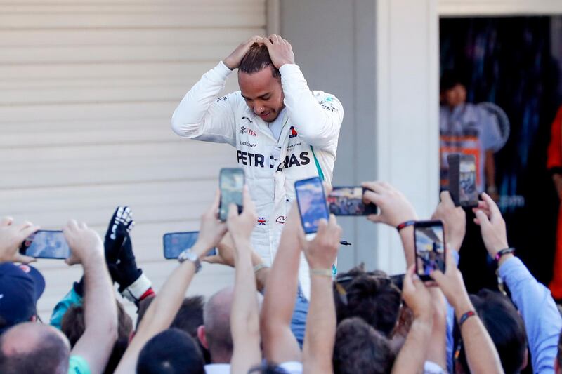 epa07075795 British Formula One driver Lewis Hamilton of Mercedes AMG GP reacts after winning the Japanese Formula One Grand Prix at the Suzuka Circuit in Suzuka, central Japan, 07 October 2018.  EPA/DIEGO AZUBEL