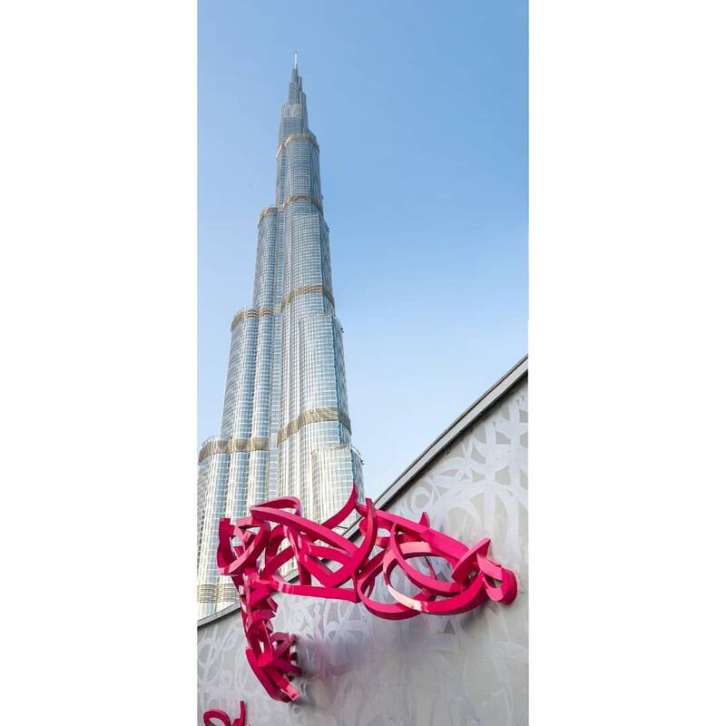 Dubai, UAE: located in Dubai's Opera District is bold-pink sculpture 'Declaration'. Of his work, eL Seed says: 'Two years in the making, one month of installation and a lifetime declaration of love to calligraphy.' Instagram / eL Seed