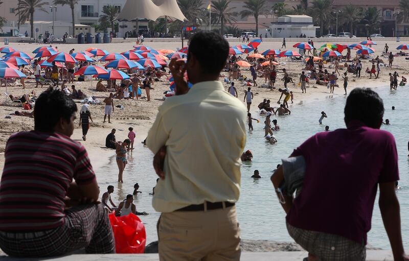 
DUBAI , UNITED ARAB EMIRATES  Ð  Nov 6 : People enjoying on the first day of Eid holiday at Jumeirah open beach in Dubai. ( Pawan Singh / The National ) For News.
