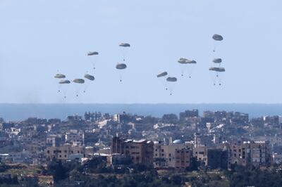 Humanitarian aid is air dropped into northern Gaza. Israel has been accused of not allowing enough aid in by land. EPA