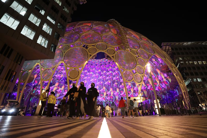 People leave Expo 2020 Dubai after watching the final audiovisual shows at Al Wasl dome. Pawan Singh / The National  