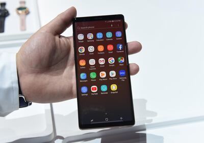 Media gather around as Samsung unveils the  Galaxy Note 9 during an Unpacked event at the Barclays Center in the New York City borough of Brooklyn August 9, 2018 (Photo by TIMOTHY A. CLARY / AFP)