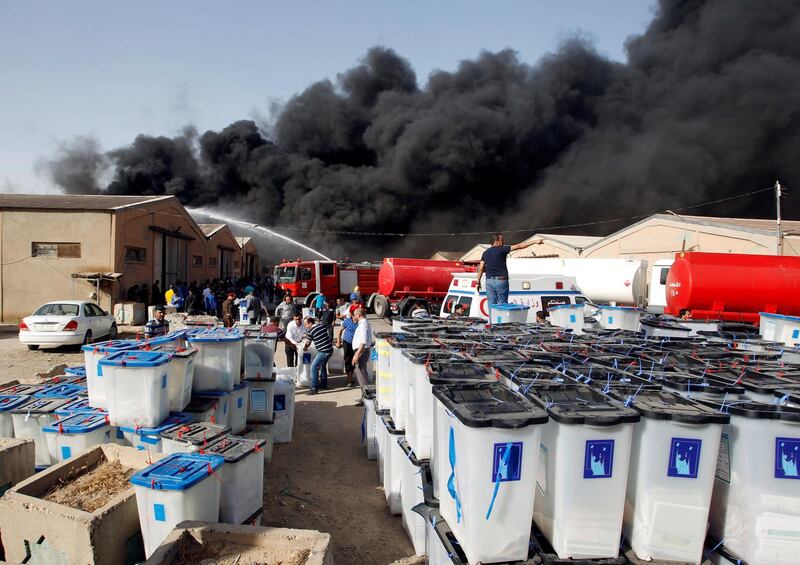 Smoke rises from a storage site in Baghdad, housing ballot boxes from Iraq's May parliamentary election, Iraq on June 10, 2018. Khalid al-Mousily / Reuters
