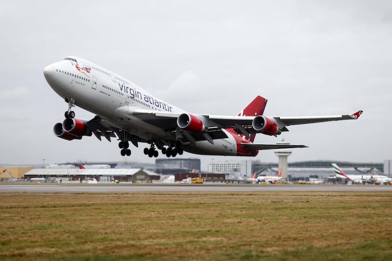 A Boeing Co. 747 passenger aircraft, operated by Virgin Atlantic Airways Ltd takes off at London Gatwick Airport in Crawley, U.K., on Tuesday, Jan. 10, 2017. Discount airlines are piling on passengers using bargain-basement pricing even as a sluggish economy and the threat of terror attacks clips demand. Photographer: Simon Dawson/Bloomberg