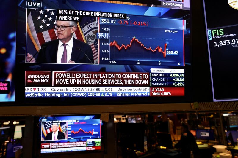 Federal Reserve Board chairman Jerome Powell appears on a screen on the trading floor of the New York Stock Exchange during a news conference following a Fed rate announcement. Reuters