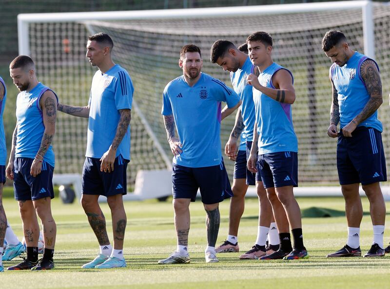 Messi chats with his teammate Paulo Dybala. EPA