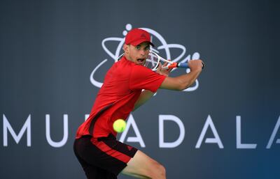 ABU DHABI, UNITED ARAB EMIRATES - DECEMBER 30:  Dominic Thiem of Austria plays a backhand during his match against Pablo Carreno Busta of Spain on day three of the Mubadala World Tennis Championship at International Tennis Centre Zayed Sports City on December 30, 2017 in Abu Dhabi, United Arab Emirates.  (Photo by Tom Dulat/Getty Images)