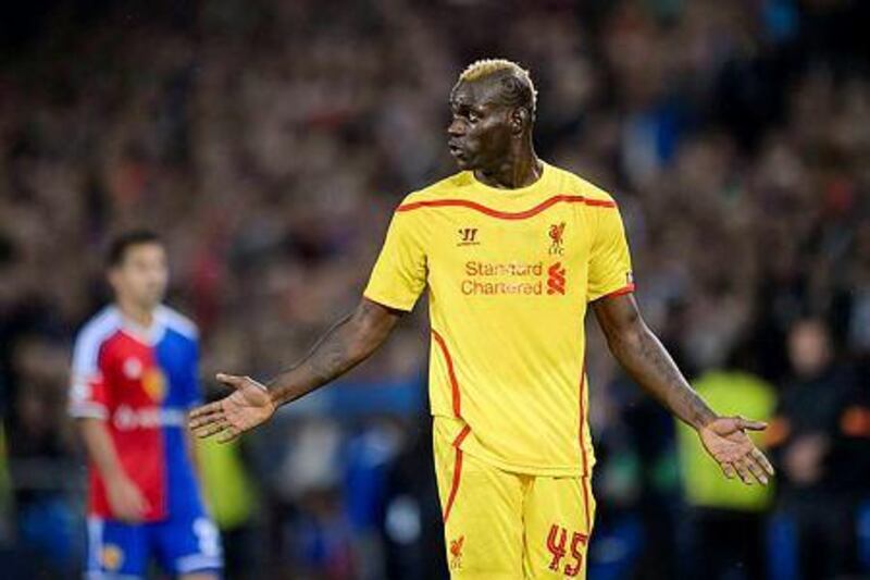 Liverpool forward Mario Balotelli reacts during the Uefa Champions League football match against Basel on October 1, 2014 at the St. Jakob-Park stadium in Basel. AFP PHOTO / FABRICE COFFRINI



