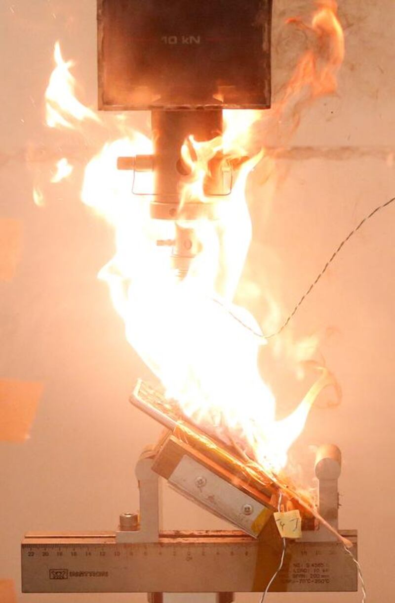 A Samsung Note 7 phone catches fire after pressure is applied to its fully charged battery during a test at the Applied Energy Hub battery laboratory in Singapore. The company may face a second recall after a replacement Note 7 apparently blew up on a US jet last week. Edgar Su / Reuters