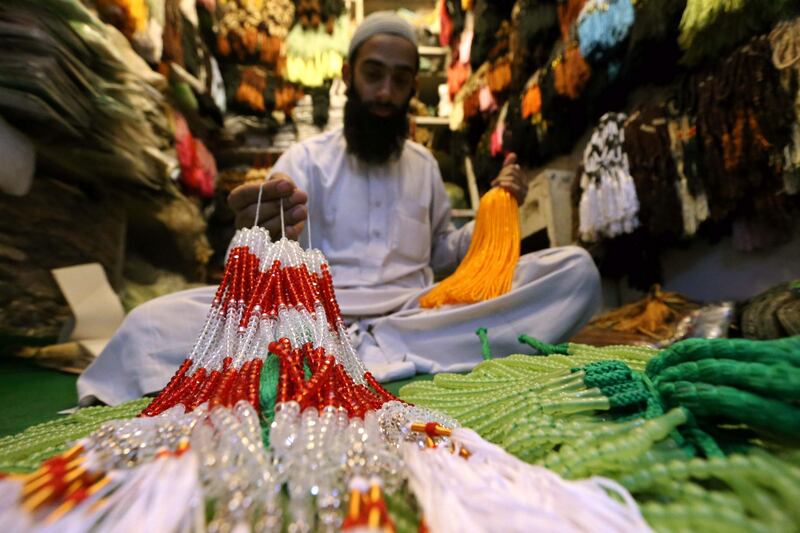 epa03780835 A vendor waits for customers at a prayer-beads shop, in Peshawar, Pakistan, 08 July 2013. Muslims across the world are preparing for the Islamic holy Fasting month of Ramadan, which which prohibits eating, drinking, smoking and sex from dawn to dusk. This year, Ramadan will begin on 09 July and end on 07 August.  EPA/BILAWAL ARBAB *** Local Caption ***  03780835.jpg