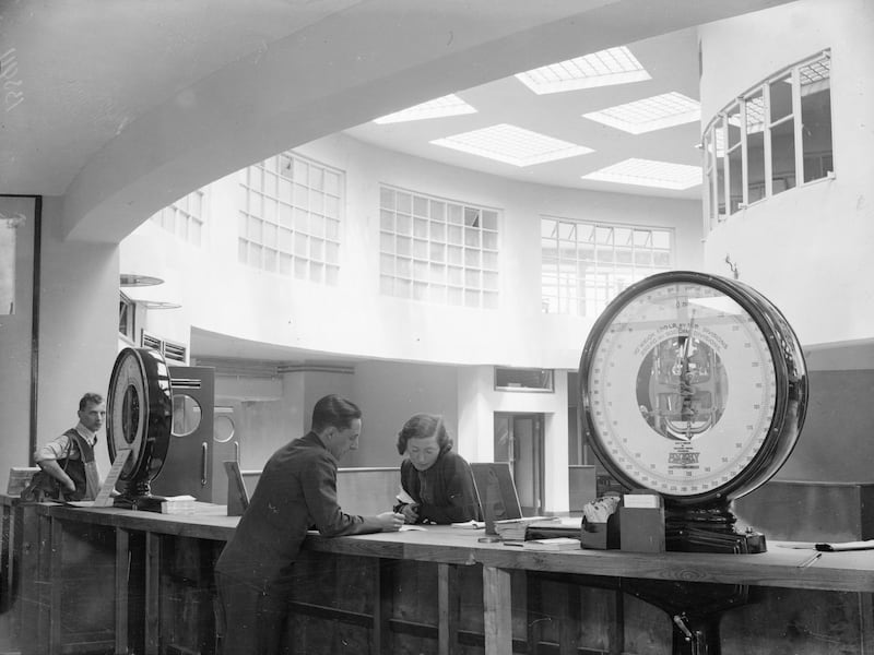 Passengers check-in at the newly opened Gatwick Airport in 1936