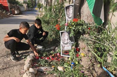 Children visit the site where journalist Shireen Abu Akleh was shot dead while covering an Israeli army raid in the occupied West Bank, in Jenin. AFP