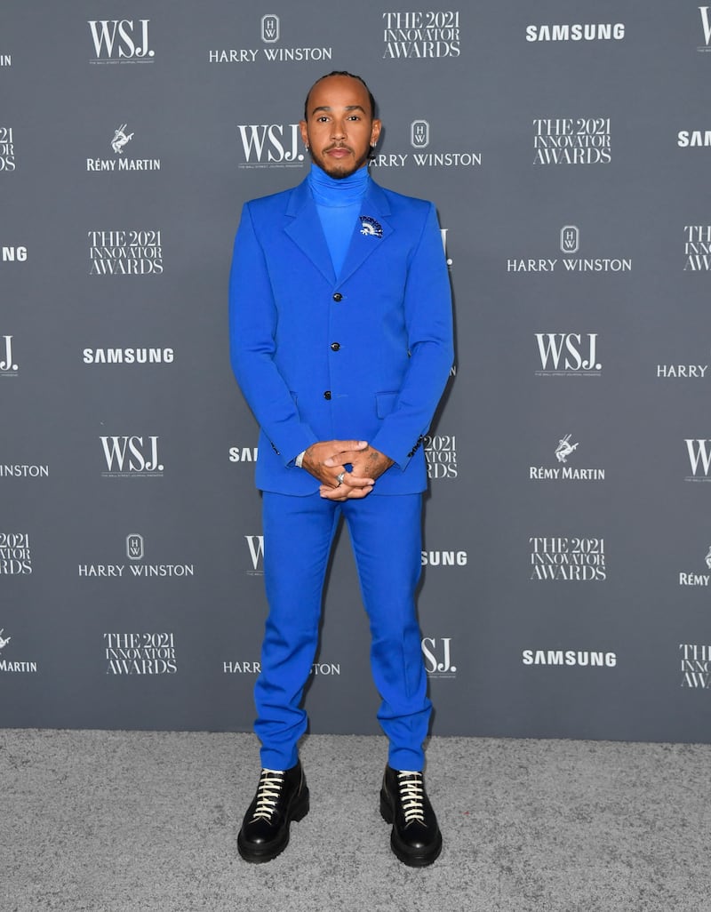 Lewis Hamilton, in a blue AMI Alexandrew Mattiussi suit and polo neck, attends the WSJ Magazine Innovator Awards at the Museum of Modern Art on November 1, 2021, in New York City. AFP