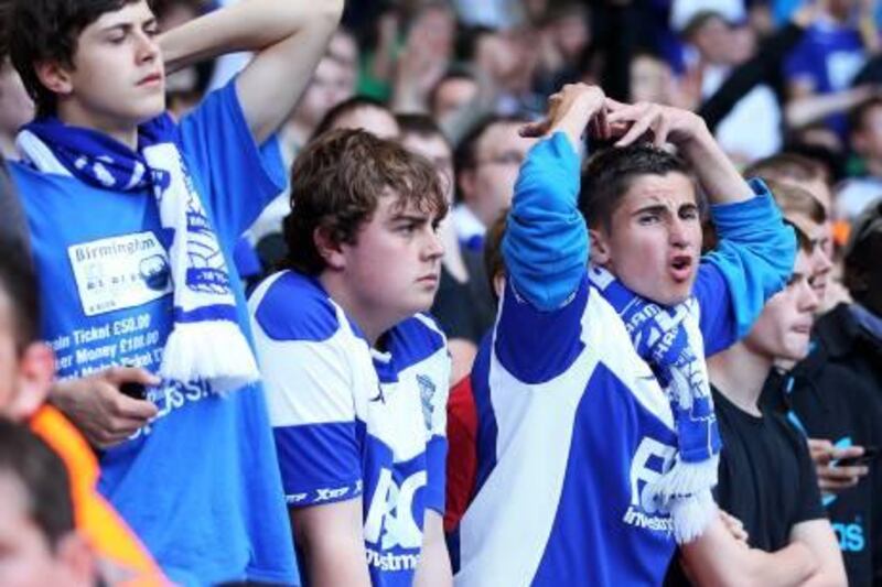 LONDON, ENGLAND - MAY 22:  Birmingham City fans look dejected during of the Barclays Premier League match between Tottenham Hotspur and Birmingham City at White Hart Lane on May 22, 2011 in London, England.  (Photo by Julian Finney/Getty Images)