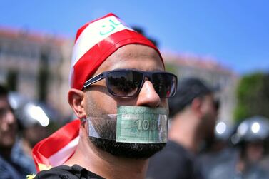 Beirut demonstrators respond to restrictions imposed by the Lebanese monetary authorities on foreign currency withdrawals. Prime Minister Saad Hariri is due to visit Dubai for a Lebanese-UAE investment conference on October 7 amid mounting pressure on the Lebanese currency. AP 