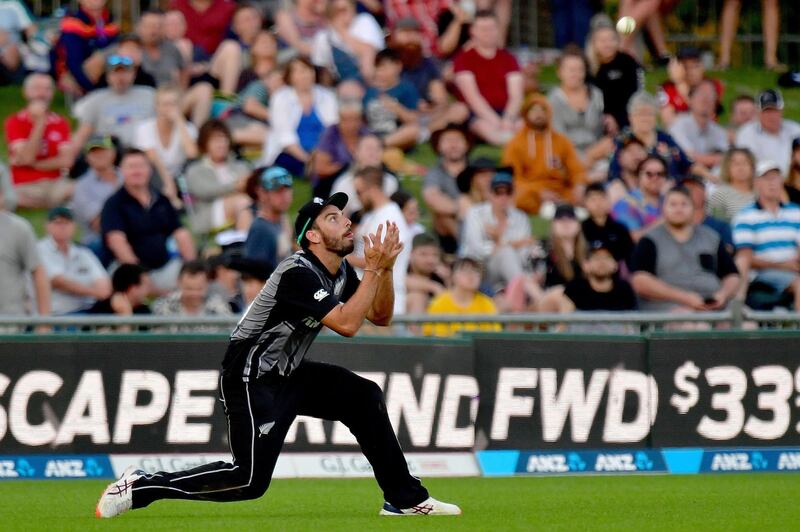 New Zealand's Daryl Mitchell catches out England captain Eoin Morgan. AFP
