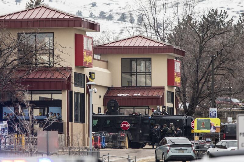 Police used armored vehicles to smash windows and walls to gain access as a gunman opened fire at a King Sooper's grocery store. AFP