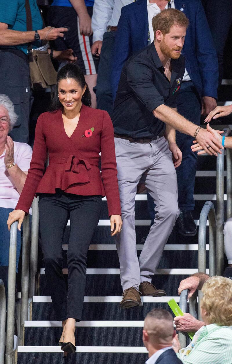 Meghan, Duchess of Sussex wears a Scanlan Theodore jacket, Outland Denim jeans and Sarah Flint shoe at The Invictus Games in Sydney, Australia, on October 27, 2018. AP