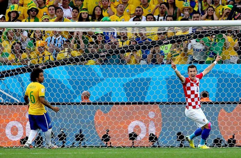 Ivan Perisic, right, of Croatia, celebrates after Marcelo, left, scores an own goal to put Croatia 1-0 up early during Thursday's World Cup kickoff match in Sao Paulo, Brazil. Diego Azubel / EPA