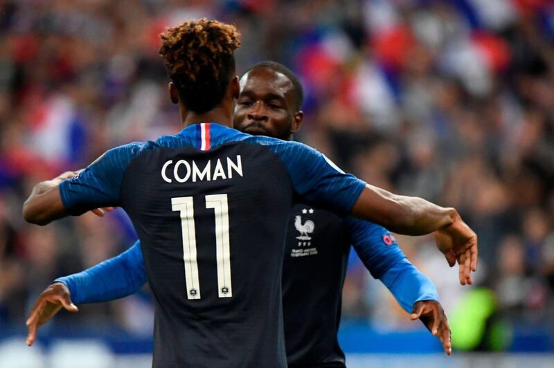 France's Kingsley Coman is congratulated by Jonathan Ikone after he scored the opening goal. AFP