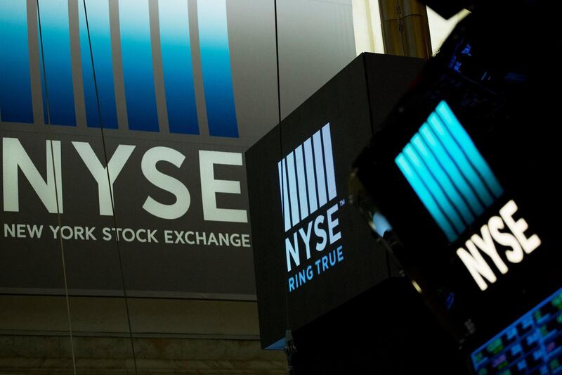 In this Thursday, May 10, 2018, photo, signs for the New York Stock Exchange hang above the trading floor. The NYSE has named its first female leader in the history of the 226-year-old exchange. The parent company of the NYSE, Intercontinental Exchange Inc., told The Wall Street Journal late Monday, May 21, 2018, that Stacey Cunningham will become the 67th president. Sheâ€™s currently NYSEâ€™s chief operating officer. Cunningham will start her new job on Friday, May 25. She succeeds Thomas Farley, who came to the NYSE in November 2013. (AP Photo/Mark Lennihan)