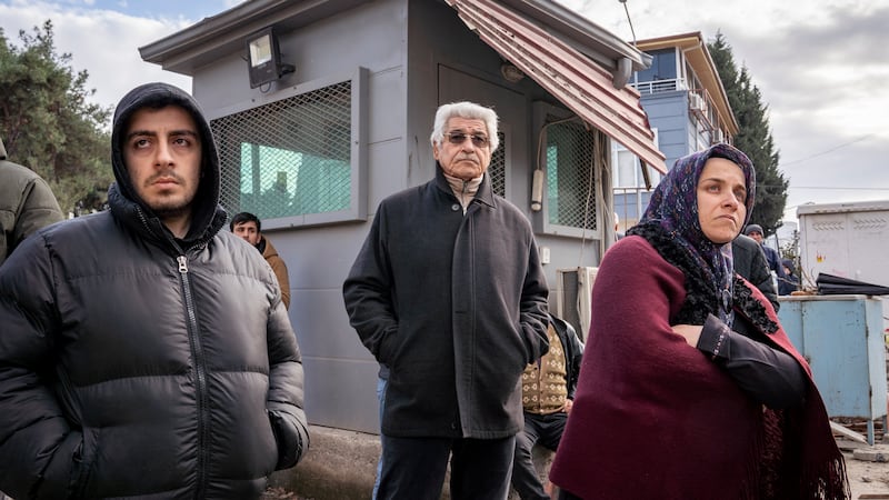 Residents of Turkish city Osmaniyeh watch as rescuers search for survivors