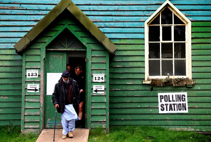 Voters leave a polling station during local elections in Birmingham. Reuters