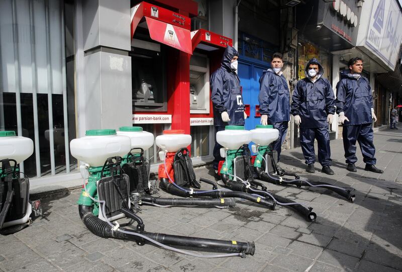 Iranian firefighters prepare to disinfect streets in an effort to halt the spread of coronavirus in Tehran on March 13, 2020. EPA