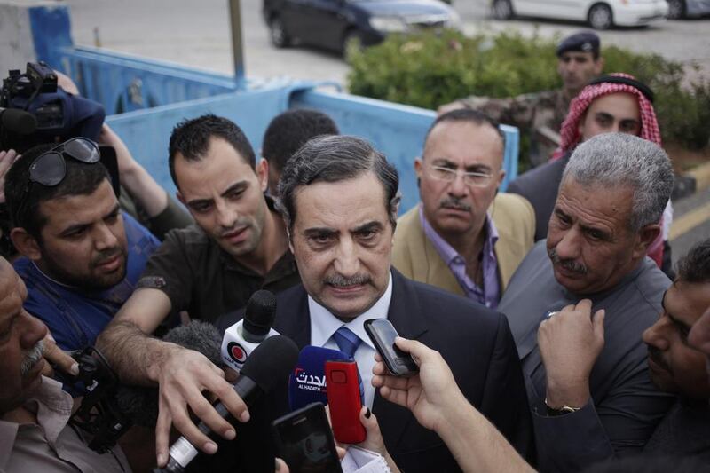 Fawaz Al Itan, the Jordanian ambassador in Libya, centre, speaking to the press upon his arrival at Marka Military Airport, in Amman, Jordan on May 13, 2014. The ambassador was released by his captors after his abduction in Tripoli last month. Mohammad Hannon/AP Photo