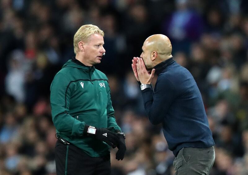 Manchester City manager Pep Guardiola talks to fourth official Kevin Bloom. Getty Images