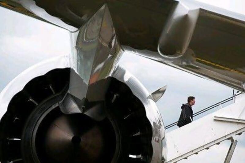 A man walks up the staircase to a Boeing 787 Dreamliner aircraft at the Farnborough International Airshow in Hampshire. AFP