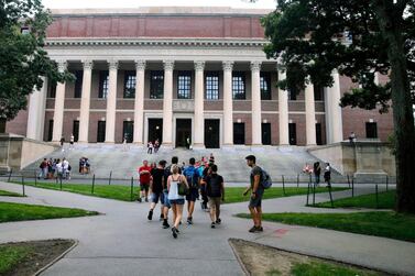 Students walk near the Widener Library at Harvard University in Cambridge. AP Photo