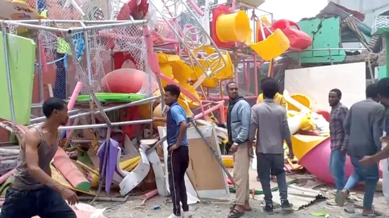 People inspect a damaged playground after an air strike in Mekele, the capital of Ethiopia's northern Tigray region, on Friday. Reuters